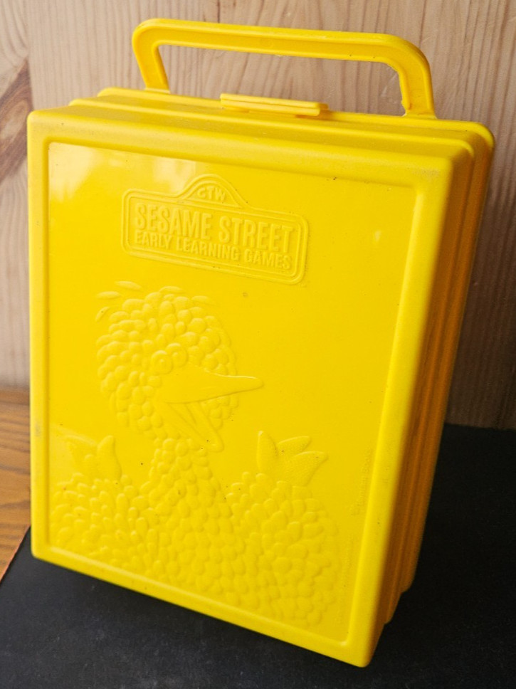 SESAME STREET EARLY LEARNING GAMES. VINTAGE YELLOW CARRY CASE. BIG BIRD IMAGE