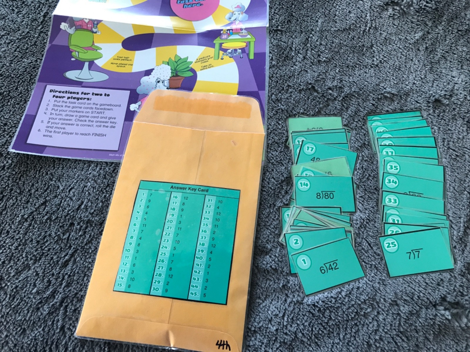 The Pampered Cat! Dividing by 6, 7, 8, 9 math file folder game grade 4
