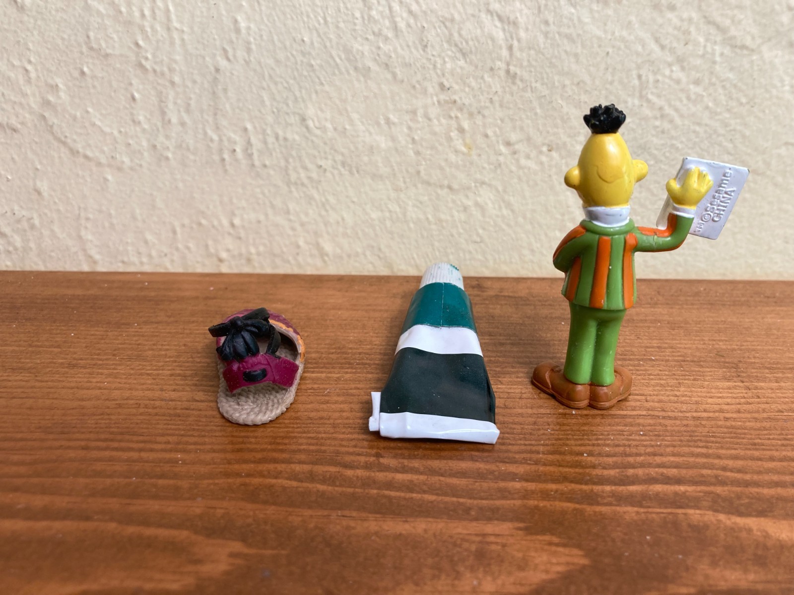 Sand tray miniature figures pose questions about memory, childhood, and history