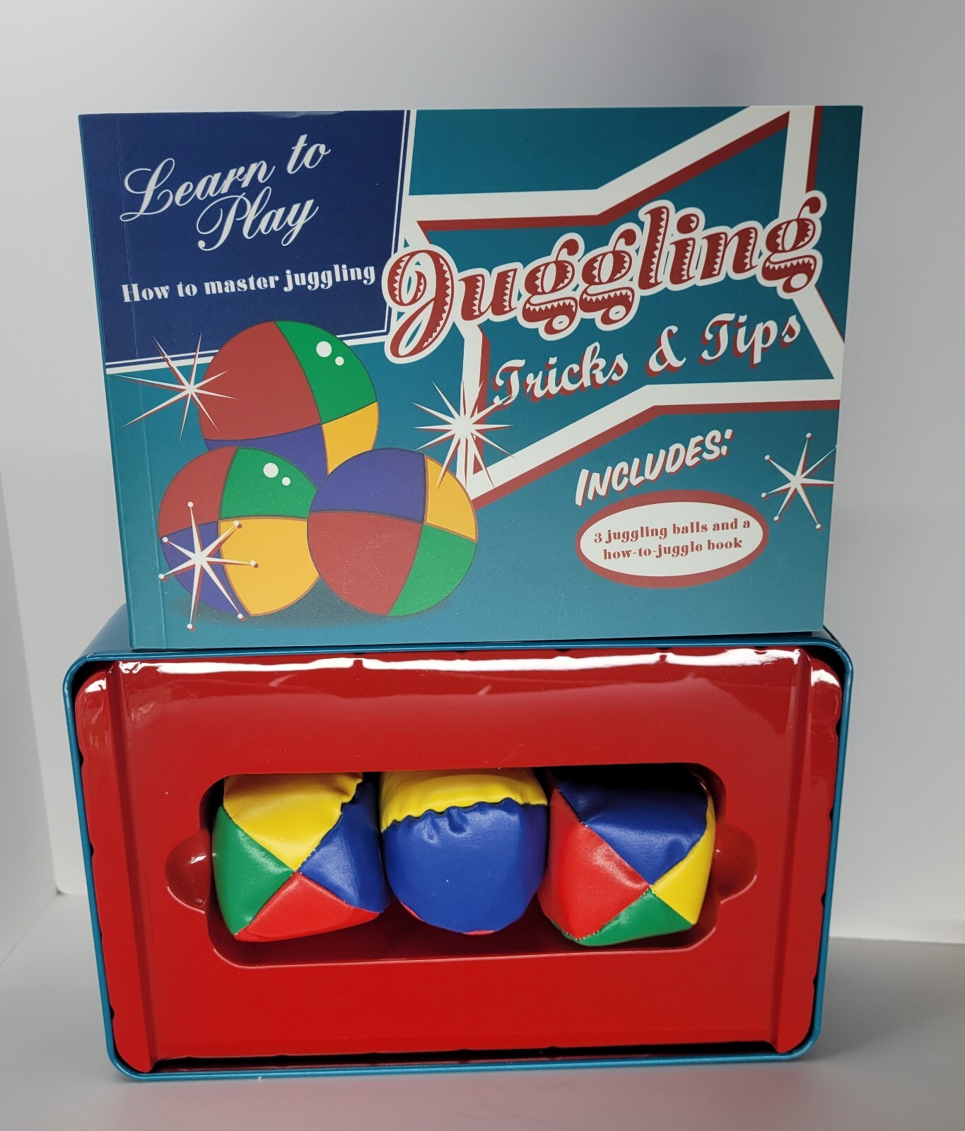 Juggling Tricks and Tips Includes Three balls and Instruction Book In Tin