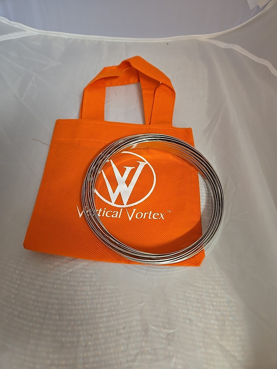 FLOW RING ARM SLINKY TOY Vertical Vortex KINETIC Toy BRACELET New Orange Carry