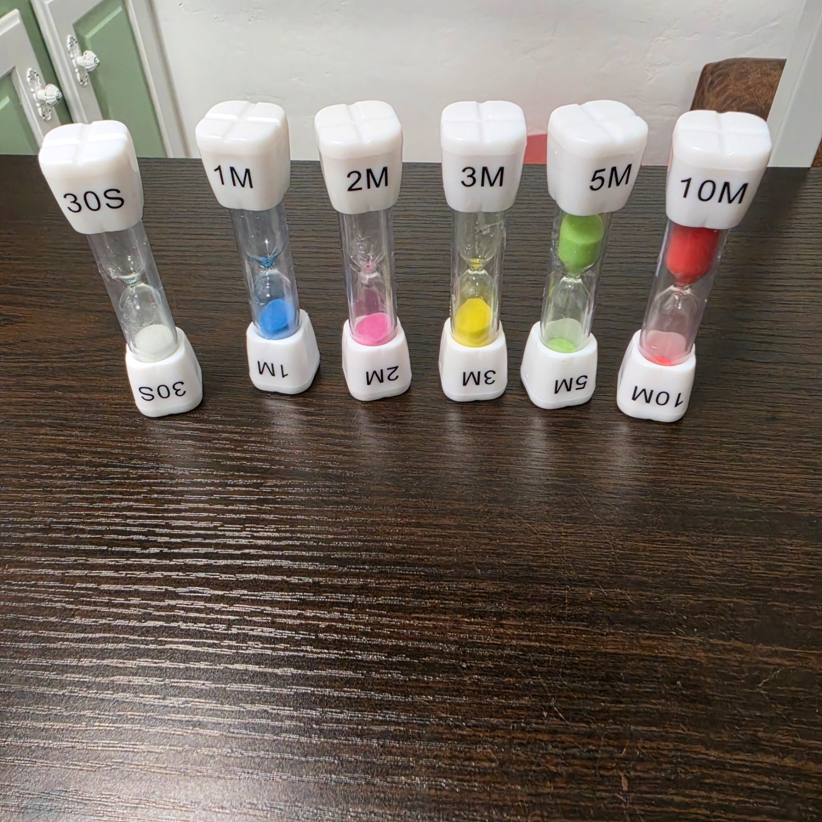 SuLiao toothbrush sand timers designed for children with various uses.