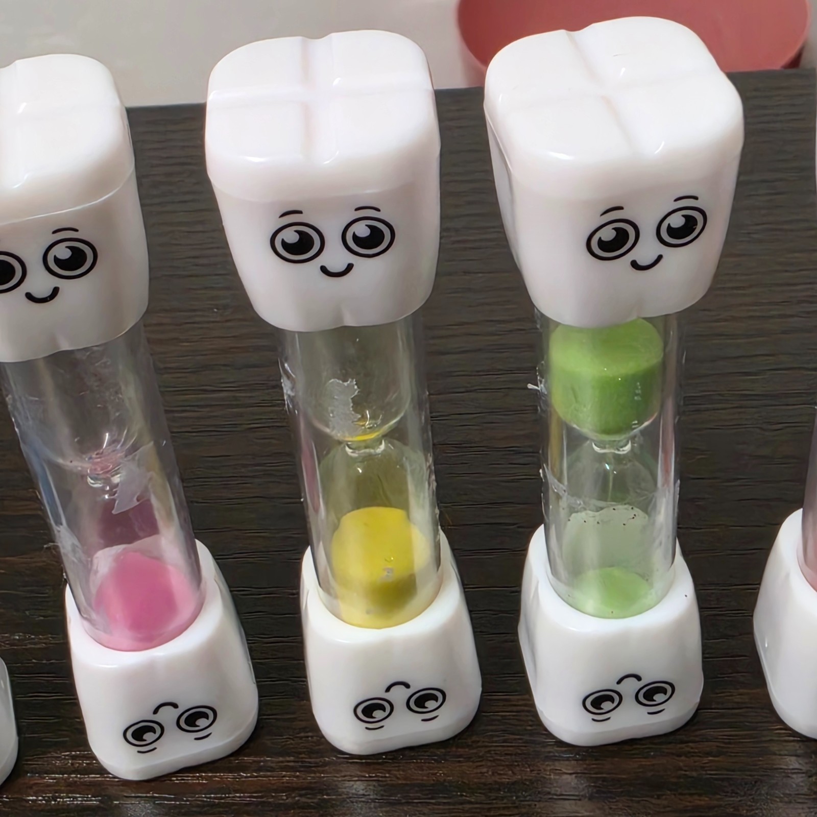 SuLiao toothbrush sand timers designed for children with various uses.