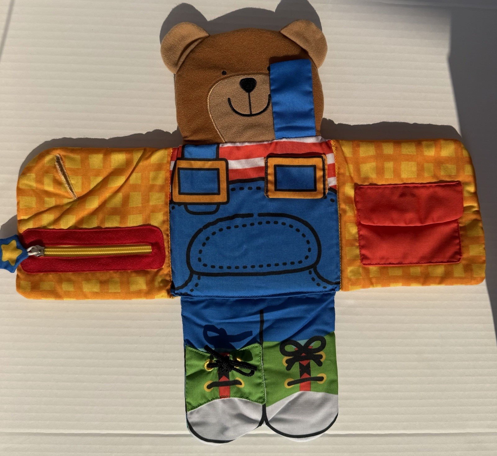 Melissa & Doug K’s Kids Dress-Up Bear Multicolor Soft Book Activity Toy