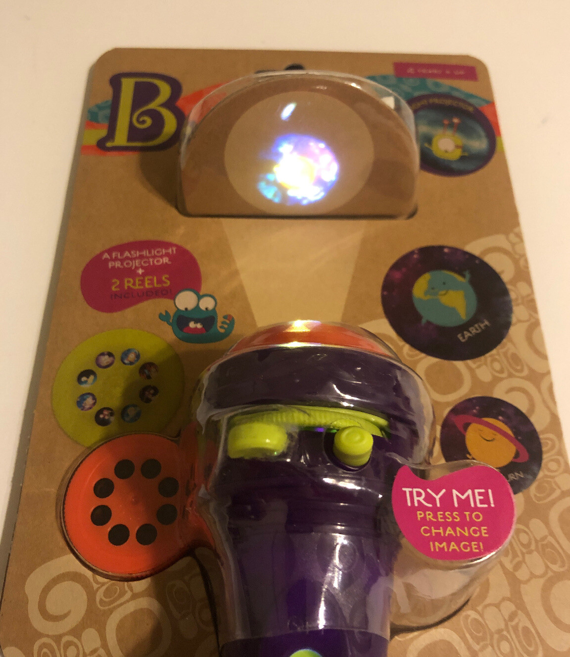 B. Toys – Light Me To The Moon Projector Flashlight Toy
