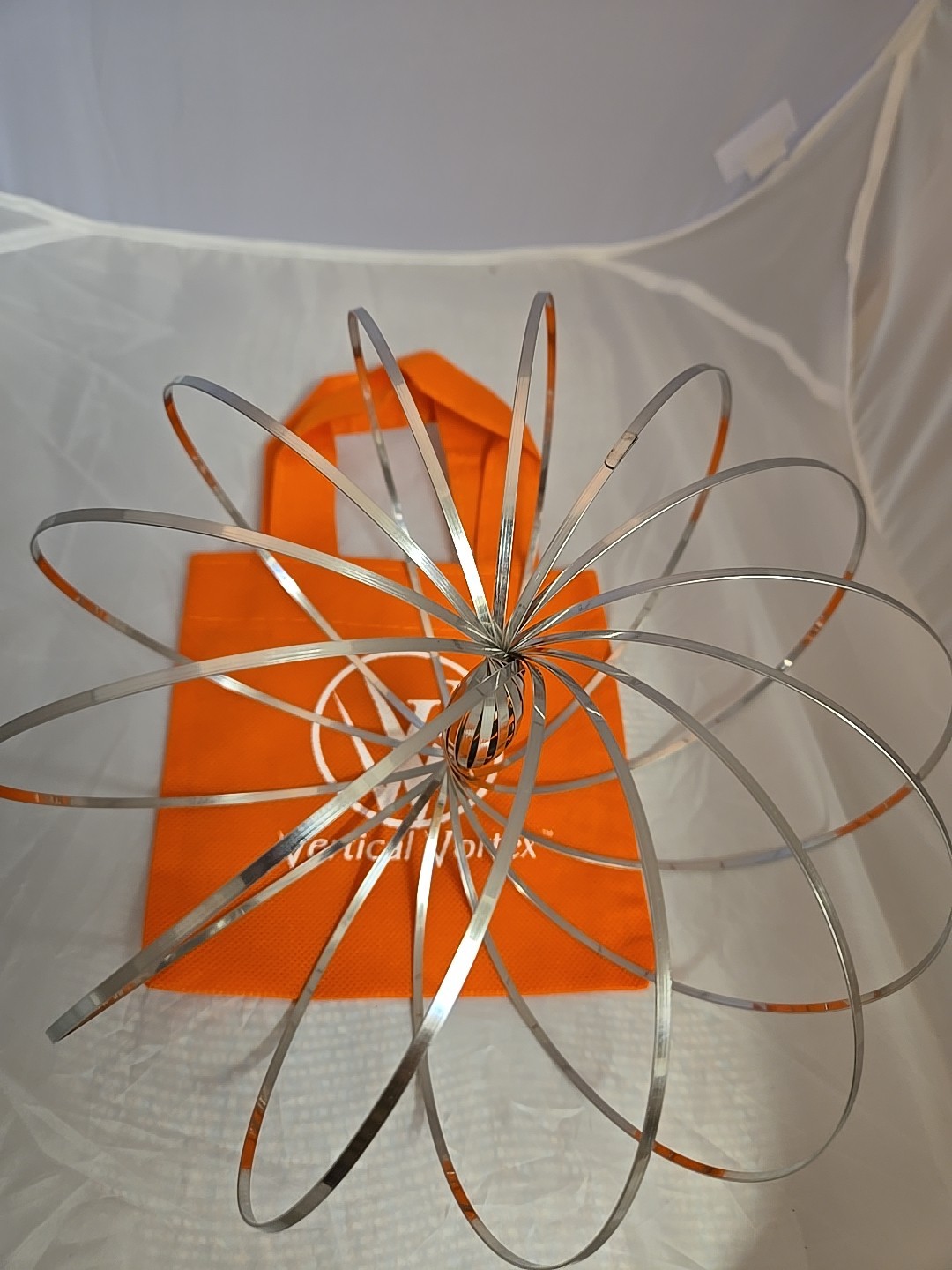 FLOW RING ARM SLINKY TOY Vertical Vortex KINETIC Toy BRACELET New Orange Carry