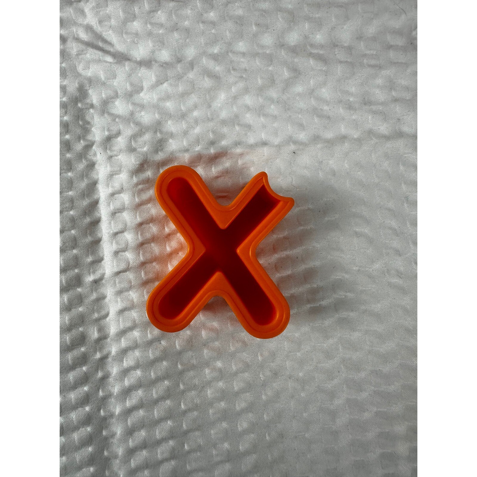 Letter “X” for Elmo On The Go learning game.