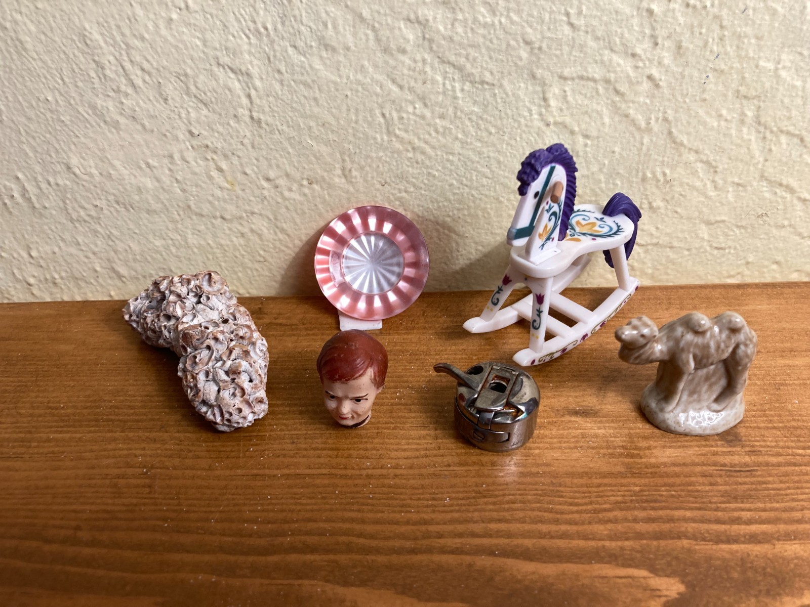 Dozen sand tray figures focus on change, challenges, growth, and stability