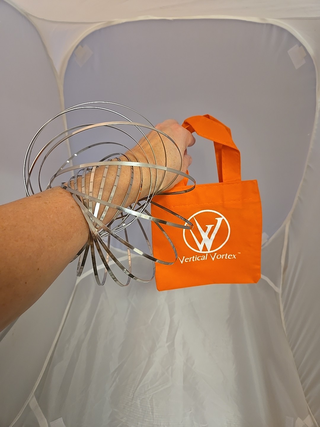 FLOW RING ARM SLINKY TOY Vertical Vortex KINETIC Toy BRACELET New Orange Carry