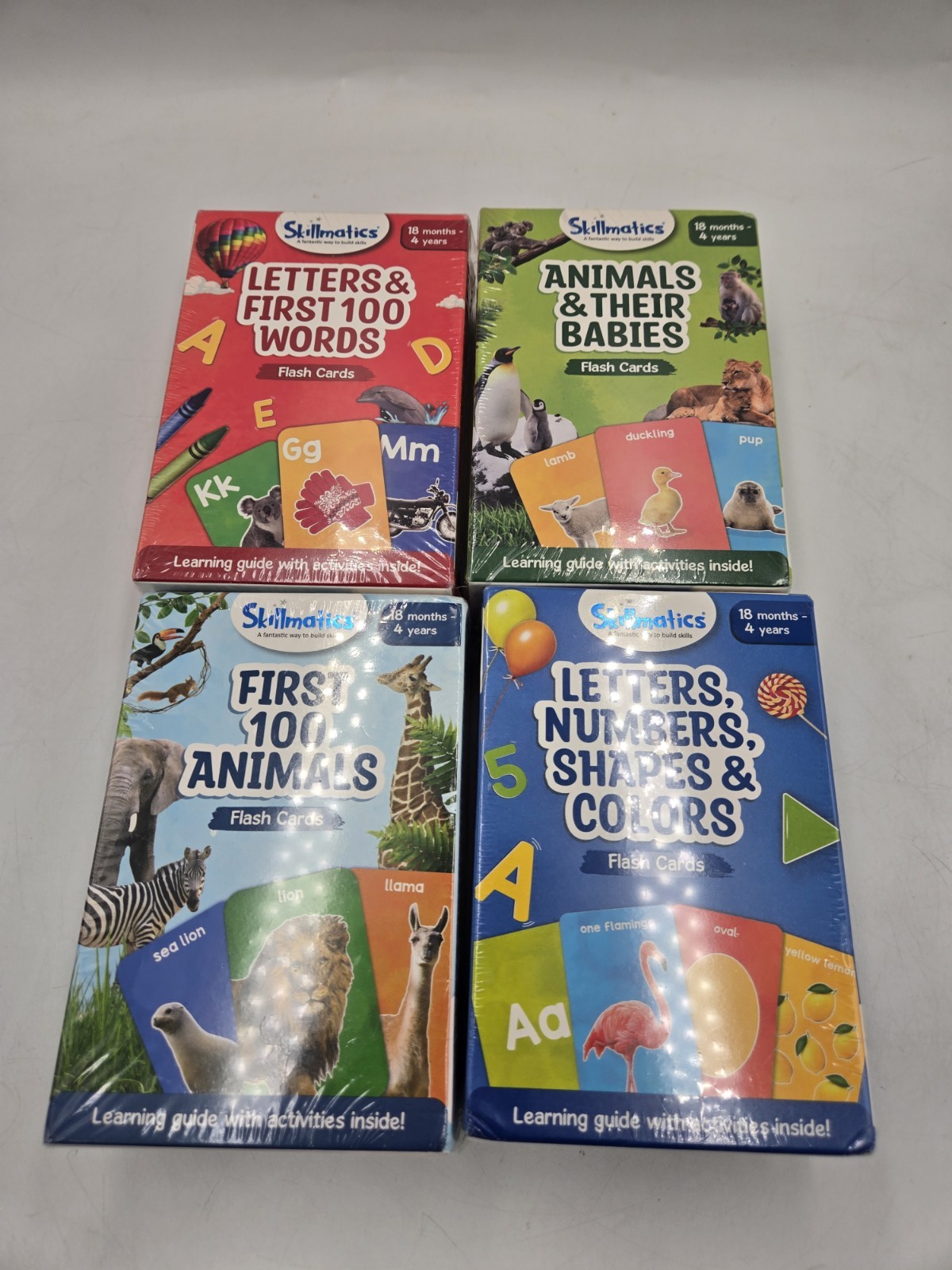 Skillmatics Flash Cards Lot Of 4. Letters Numbers Shapes & Colors, 100 Animals