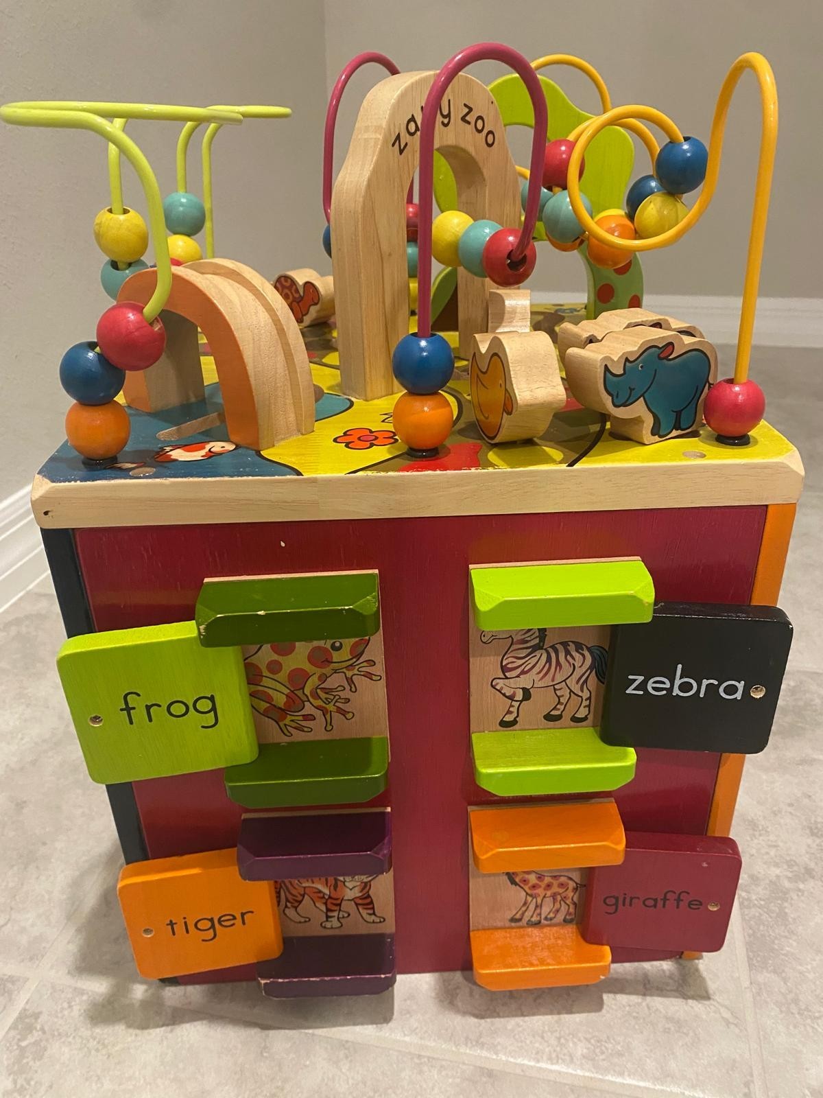 B. toys Zany Zoo Wooden Activity Cube w/ Bead Maze, Animal Blocks & Spinners