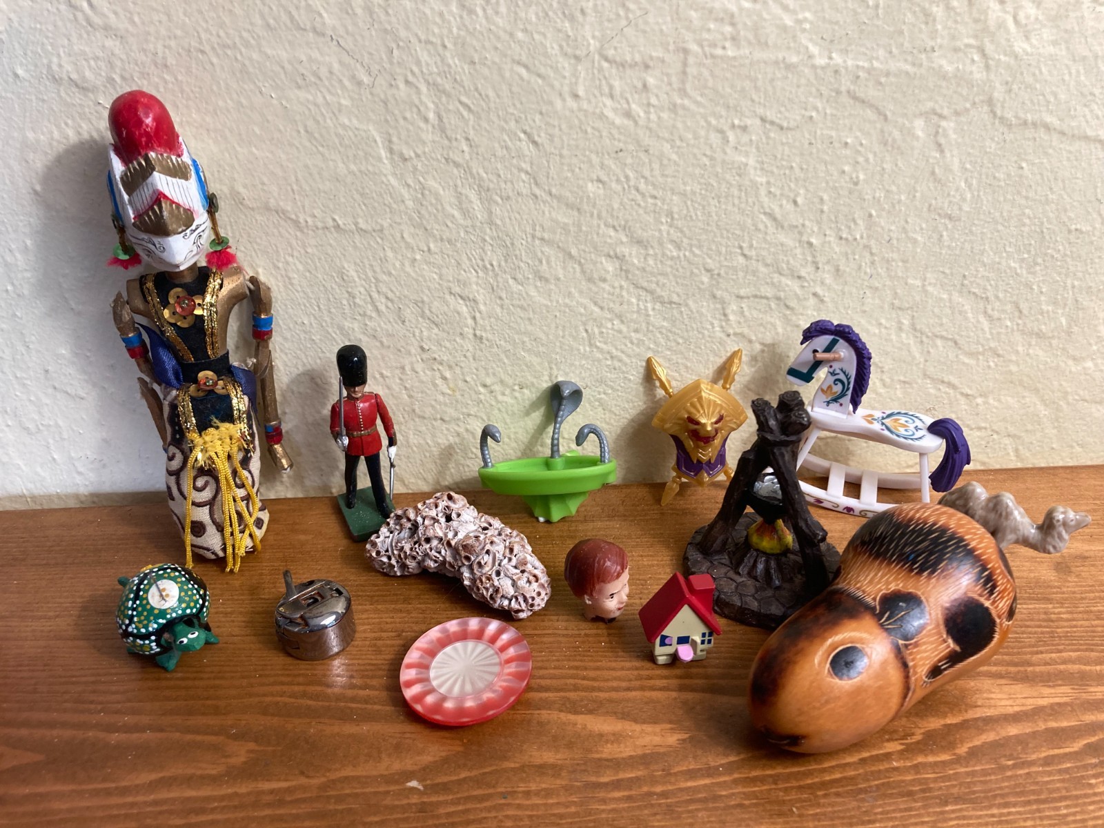 Dozen sand tray figures focus on change, challenges, growth, and stability