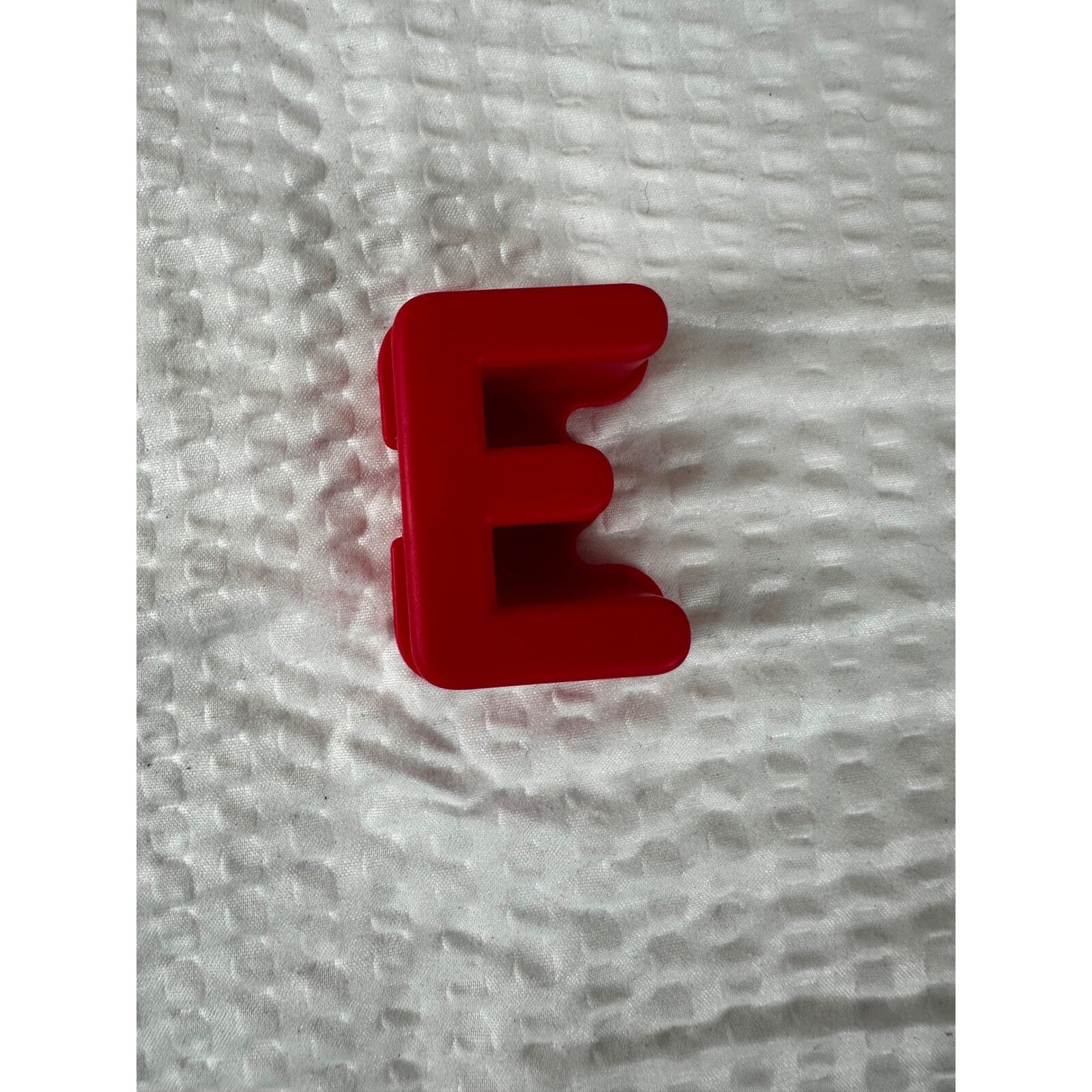 Letter “E” for Elmo On The Go learning game.