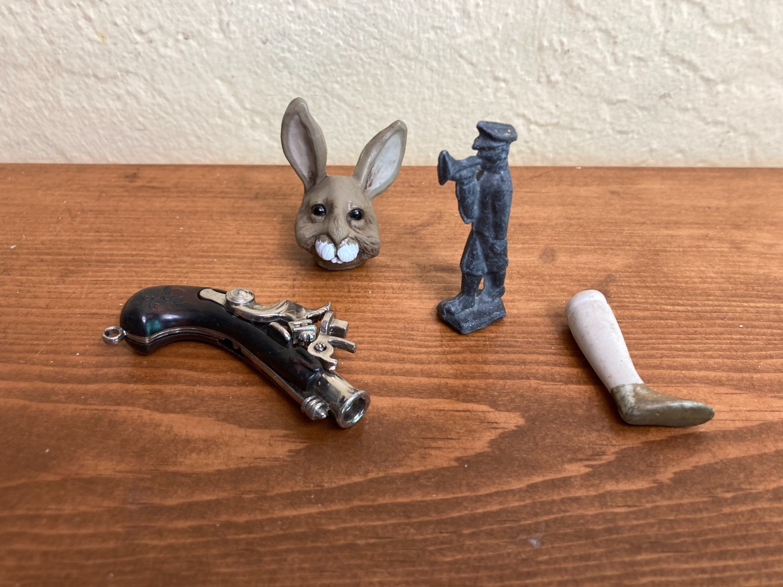 Sand tray miniature figures pose questions about memory, childhood, and history
