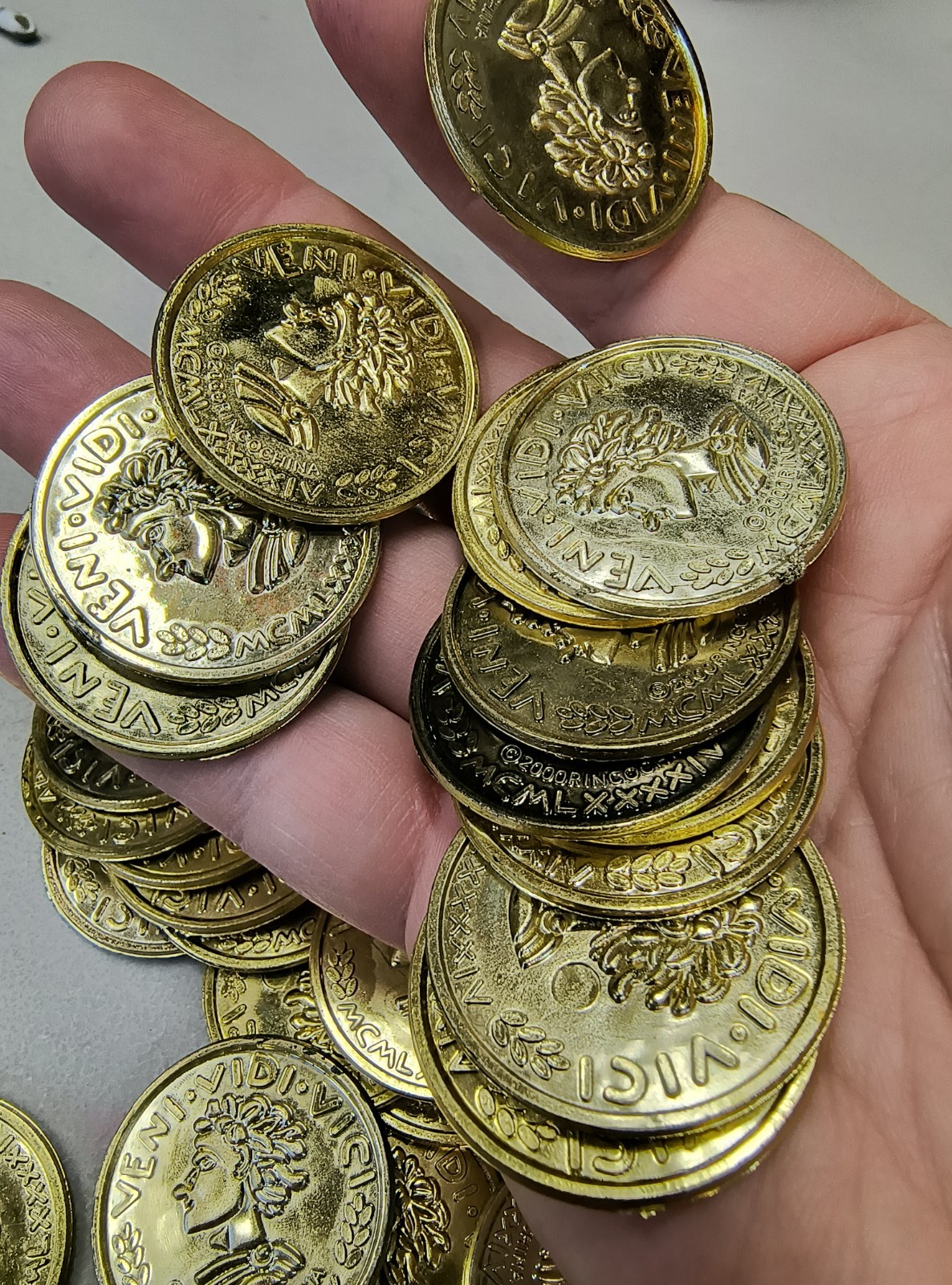 Plastic Gold Colored Toy Coins Lot of approximately – VENI VIDI VICI 2000 yr