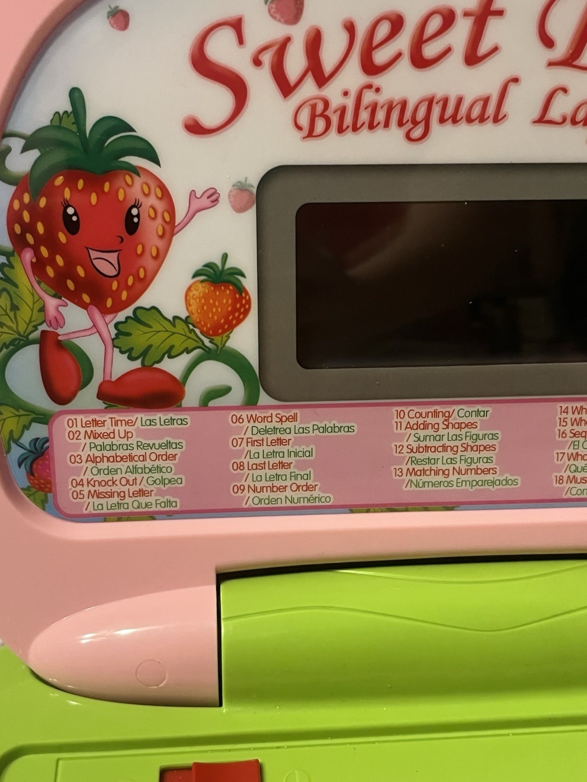 Strawberry themed Spanish and english bilingual learning toy laptop
