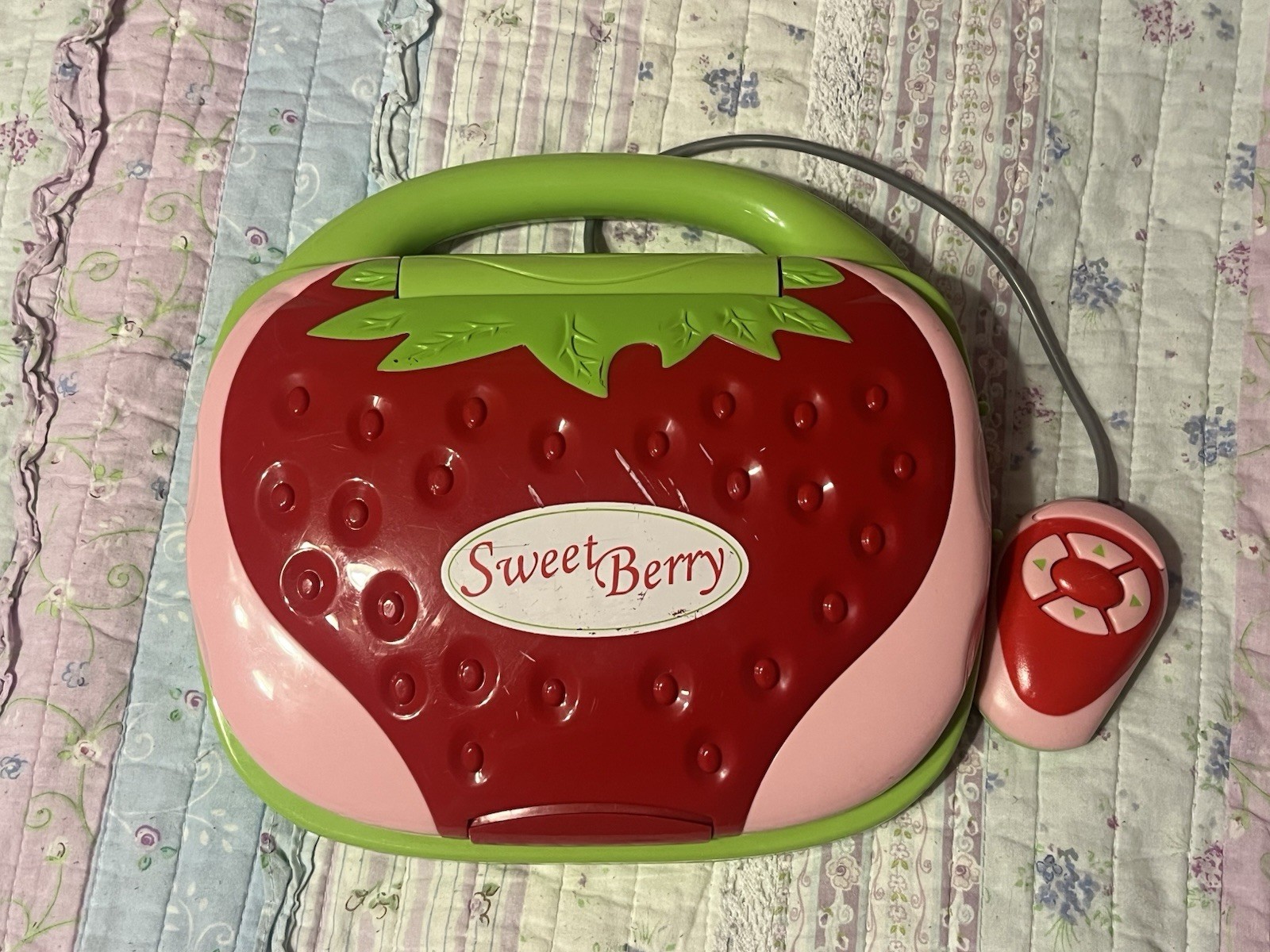 Strawberry themed Spanish and english bilingual learning toy laptop