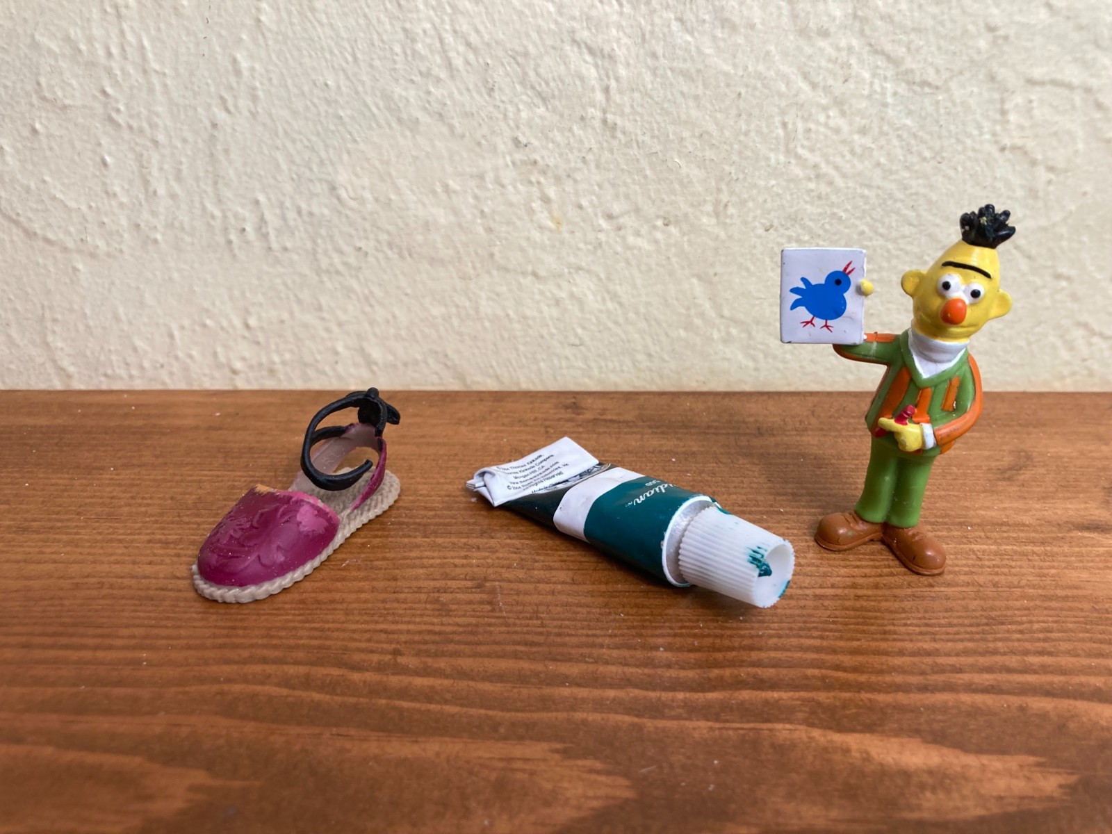 Sand tray miniature figures pose questions about memory, childhood, and history