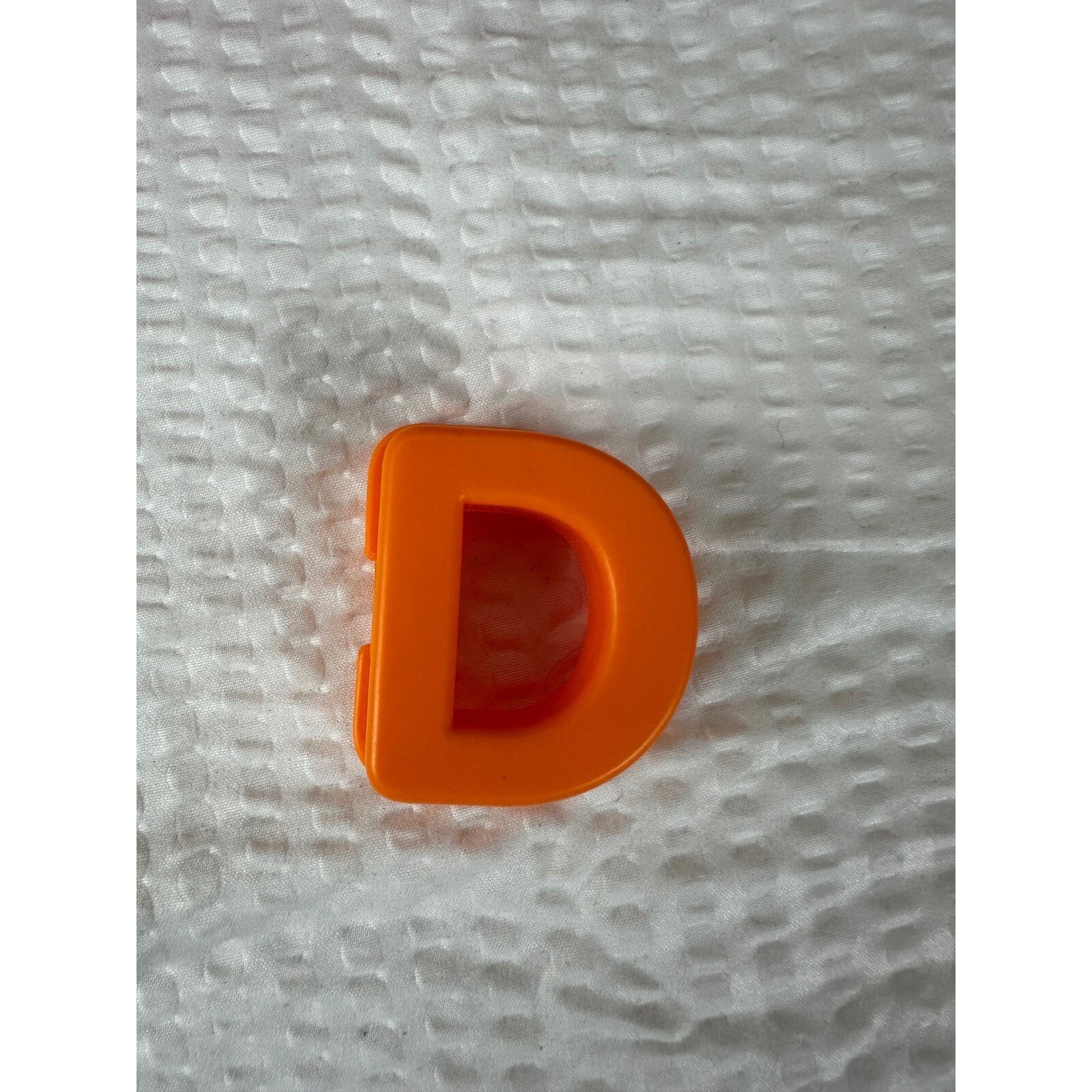Letter “D” for Elmo On The Go learning game.