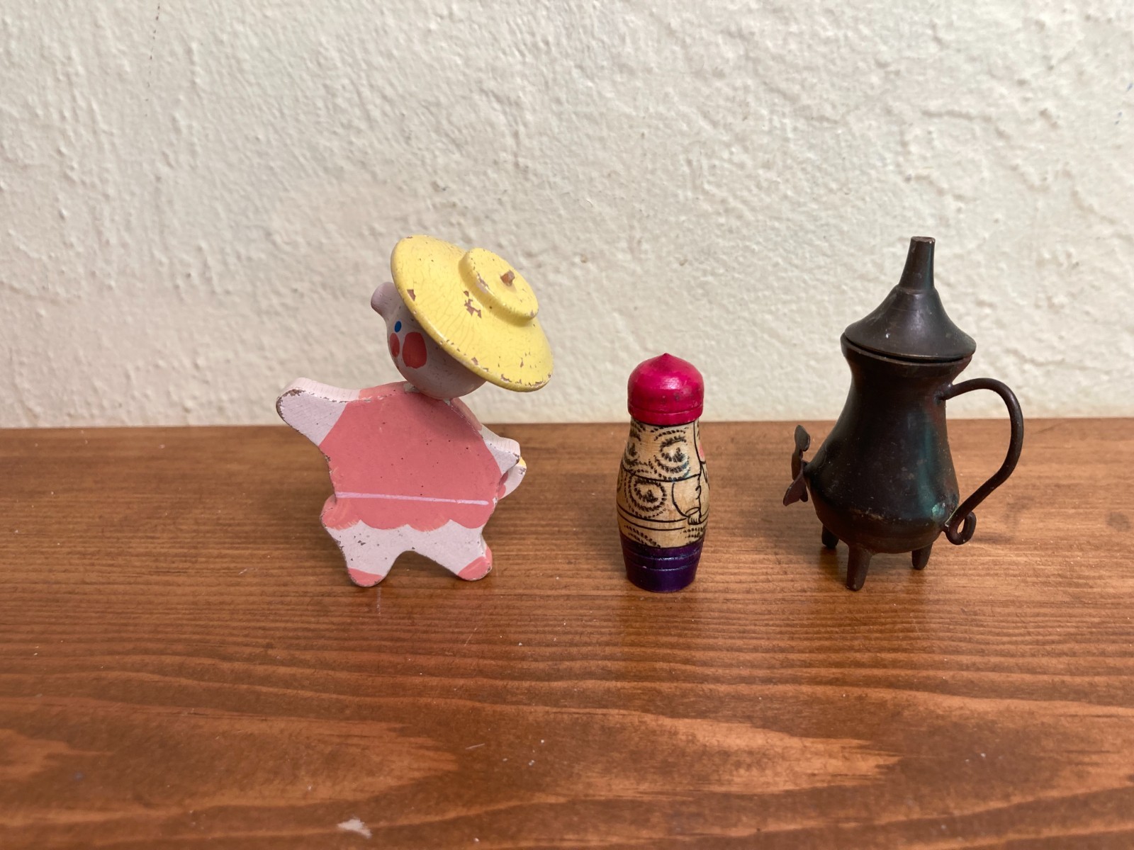Sand tray miniature figures pose questions about memory, childhood, and history