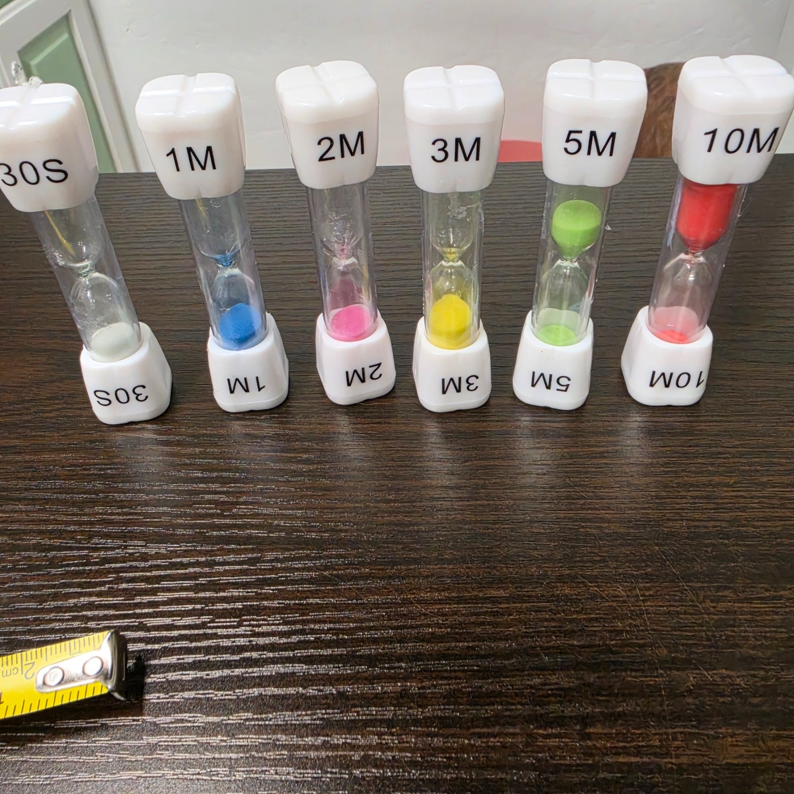 SuLiao toothbrush sand timers designed for children with various uses.