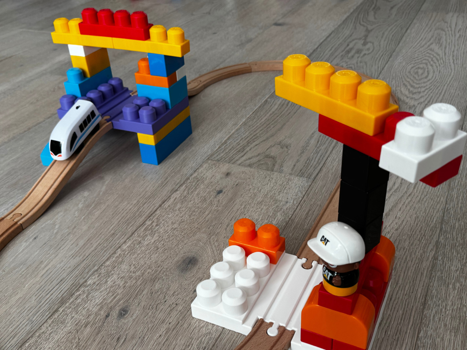 Large 2 x 4 two-sided Mega Bloks build plate with wooden train track
