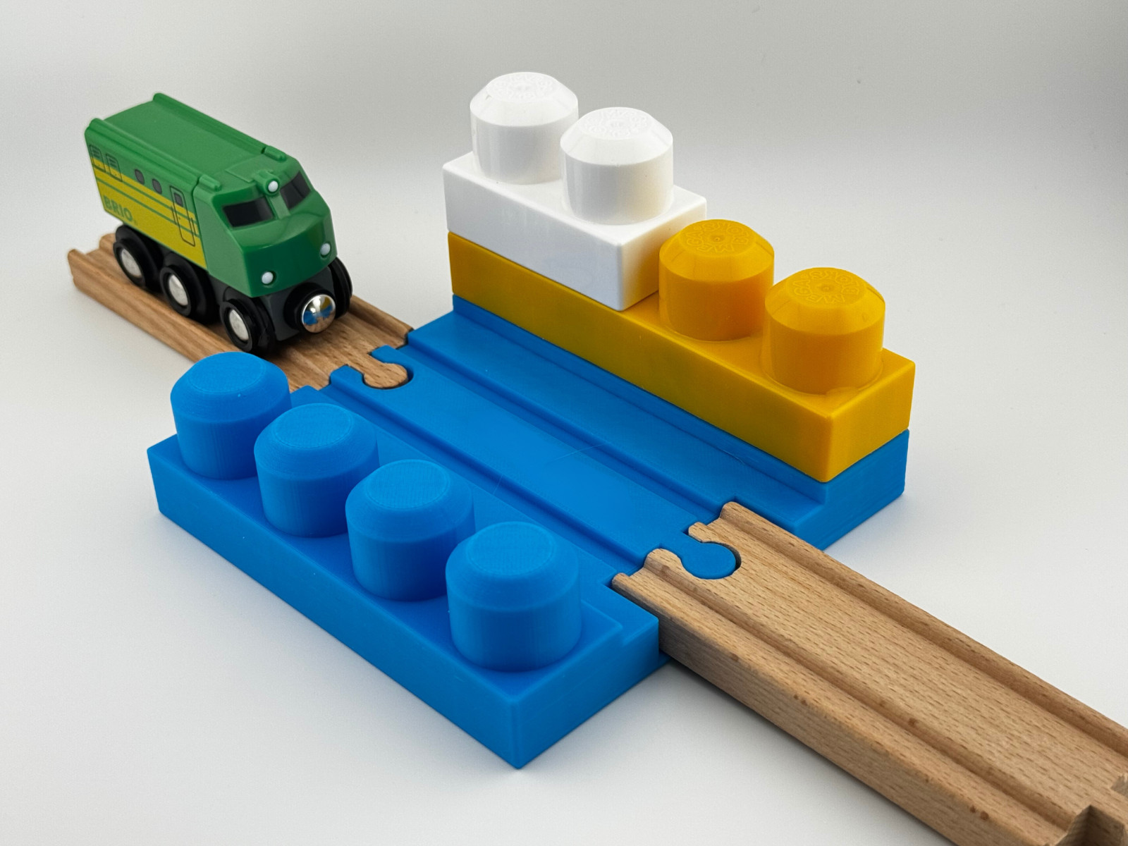Small 1 x 4 two-sided Mega Bloks build plate with wooden train track