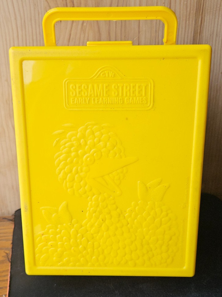 SESAME STREET EARLY LEARNING GAMES. VINTAGE YELLOW CARRY CASE. BIG BIRD IMAGE
